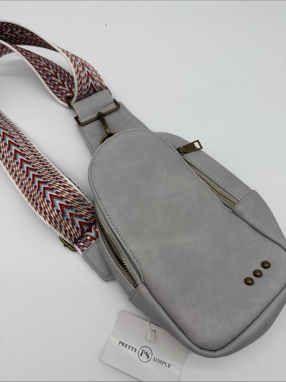 Light Gray Sling Crossbody Bag with Patterned Strap